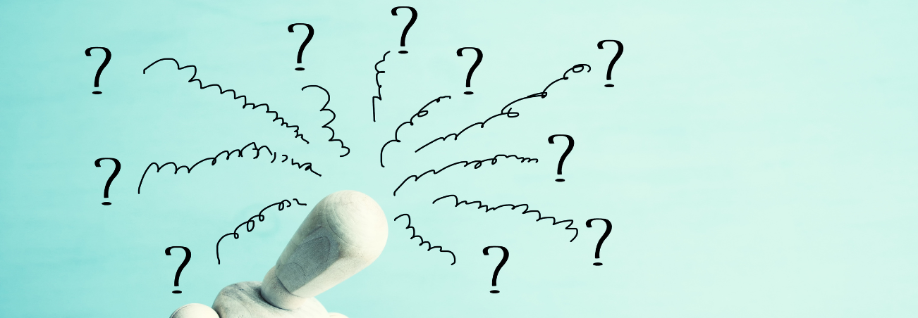 confused mannequin surrounded by question marks