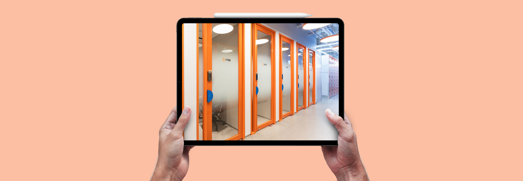 person holding a tablet with a photo of storage facility doors